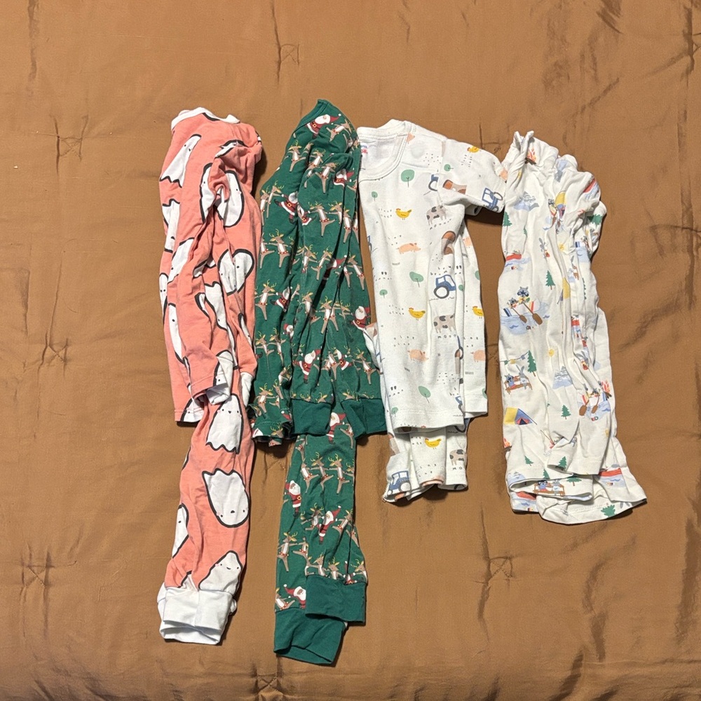 Bundle of four seasonal MagneticMe pajama sets size 18-24 months.